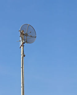 Radio communications tower and blue sky