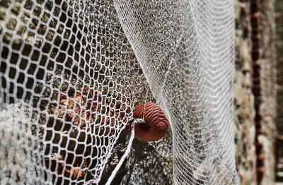 Close up of fishing net with orange float