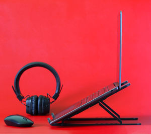 Close-up of red telephone on table