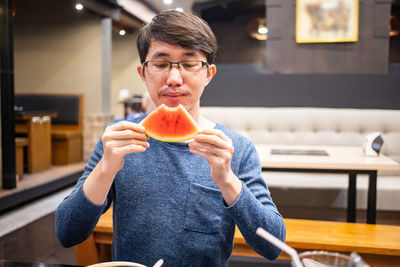 Portrait of man holding apple