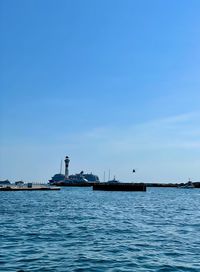 Scenic view of sea against blue sky