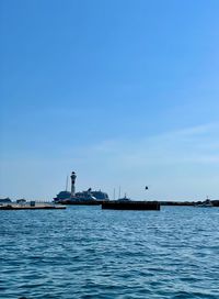 Scenic view of sea against blue sky