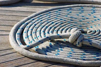 Close-up of rope tied to jetty