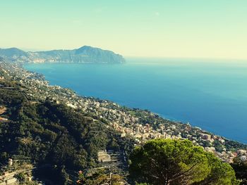 High angle view of sea and cityscape against sky