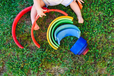 Low section of boy playing on grassland