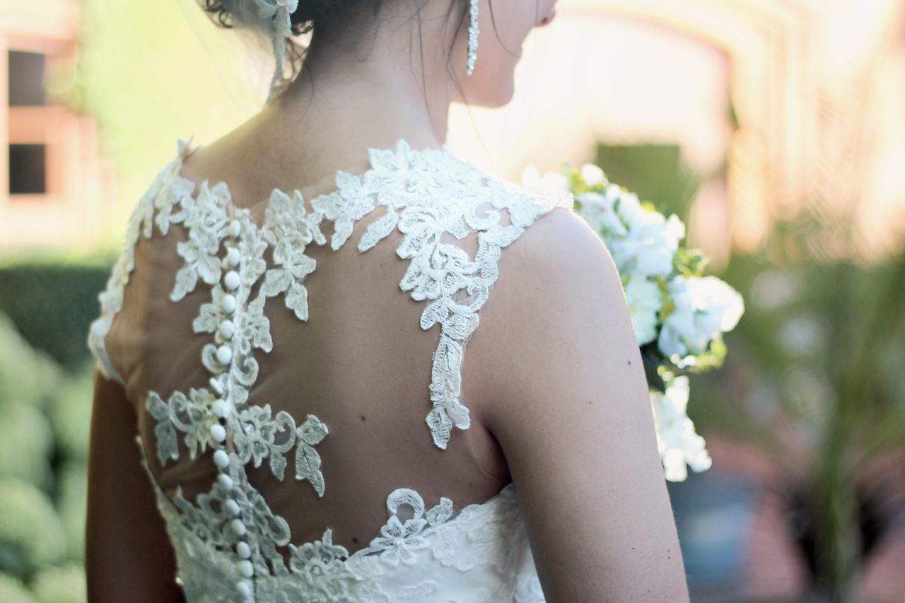 bride, wedding, wedding dress, life events, real people, focus on foreground, celebration, day, women, outdoors, flower, wedding ceremony, young women, young adult, one person, lifestyles, groom, happiness, beautiful woman, well-dressed, ceremony, close-up, people