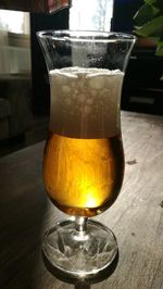 Close-up of beer glass on table