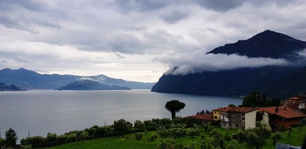 Scenic view of sea and buildings against sky