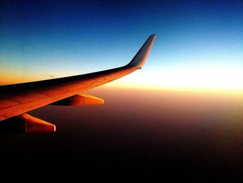 Cropped image of airplane wing