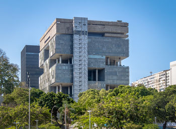 Low angle view of skyscrapers against clear sky