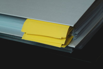 High angle view of yellow papers