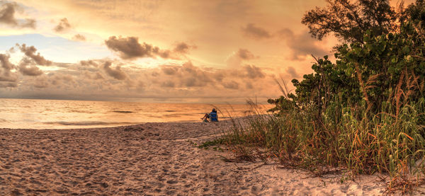 Sunset over the white sand at delnor wiggins state park in naples, florida.