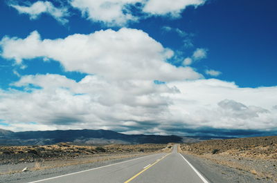 Road amidst landscape against sky