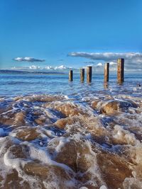 Scenic view of sea against blue sky