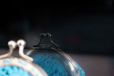 Close-up of metallic object against black background