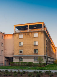 Low angle view of buildings against blue sky