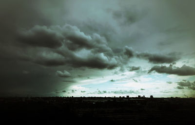 Scenic view of landscape against cloudy sky