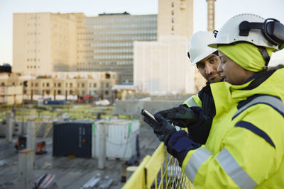 Two engineers working at construction site