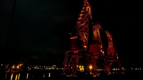 Low angle view of firework display at night