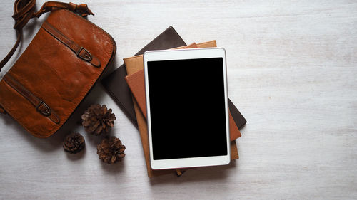 High angle view of smart phone on table