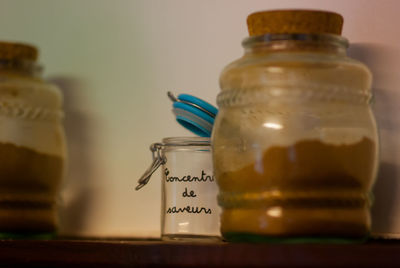 Jars on shelf against wall