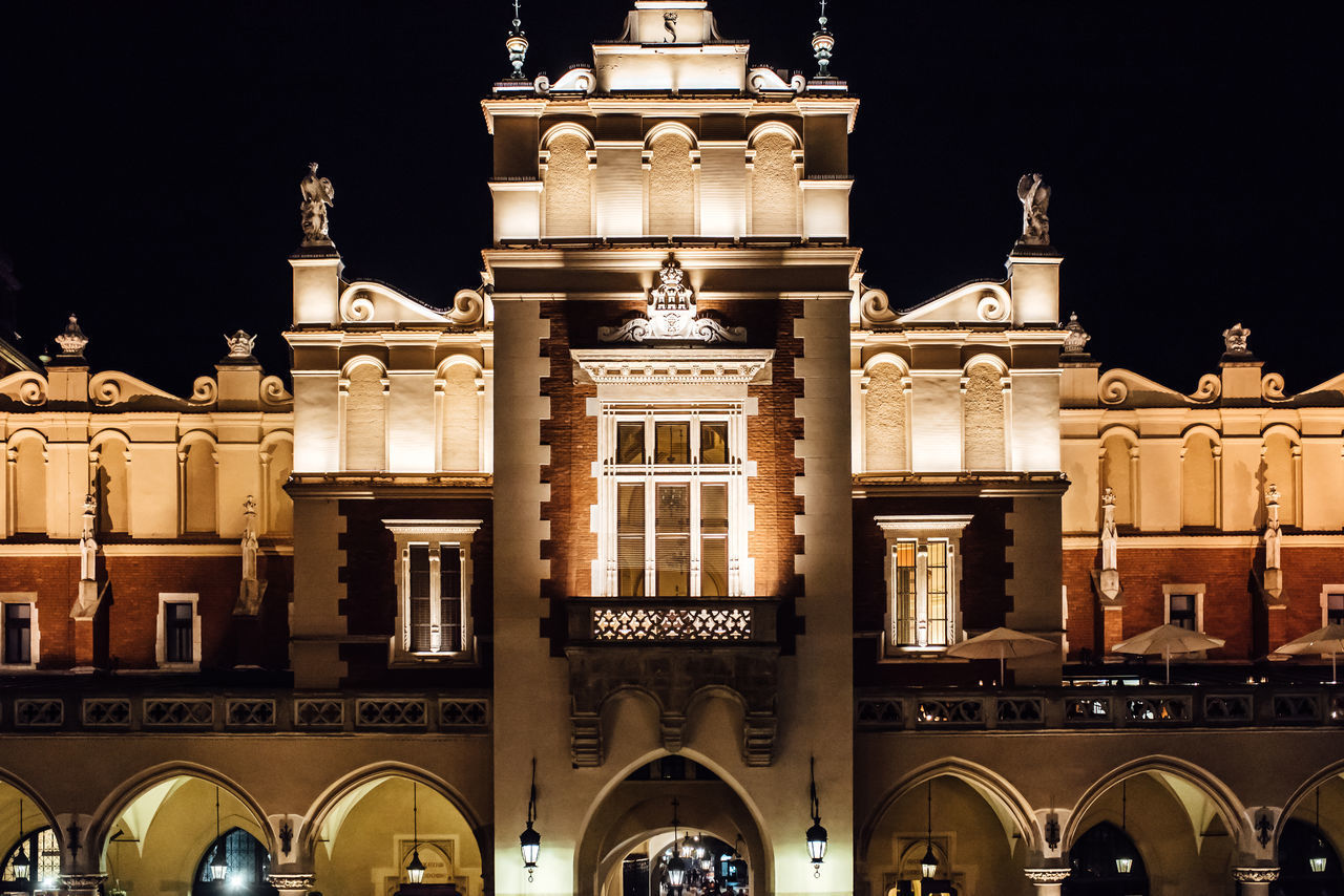 LOW ANGLE VIEW OF ILLUMINATED BUILDING