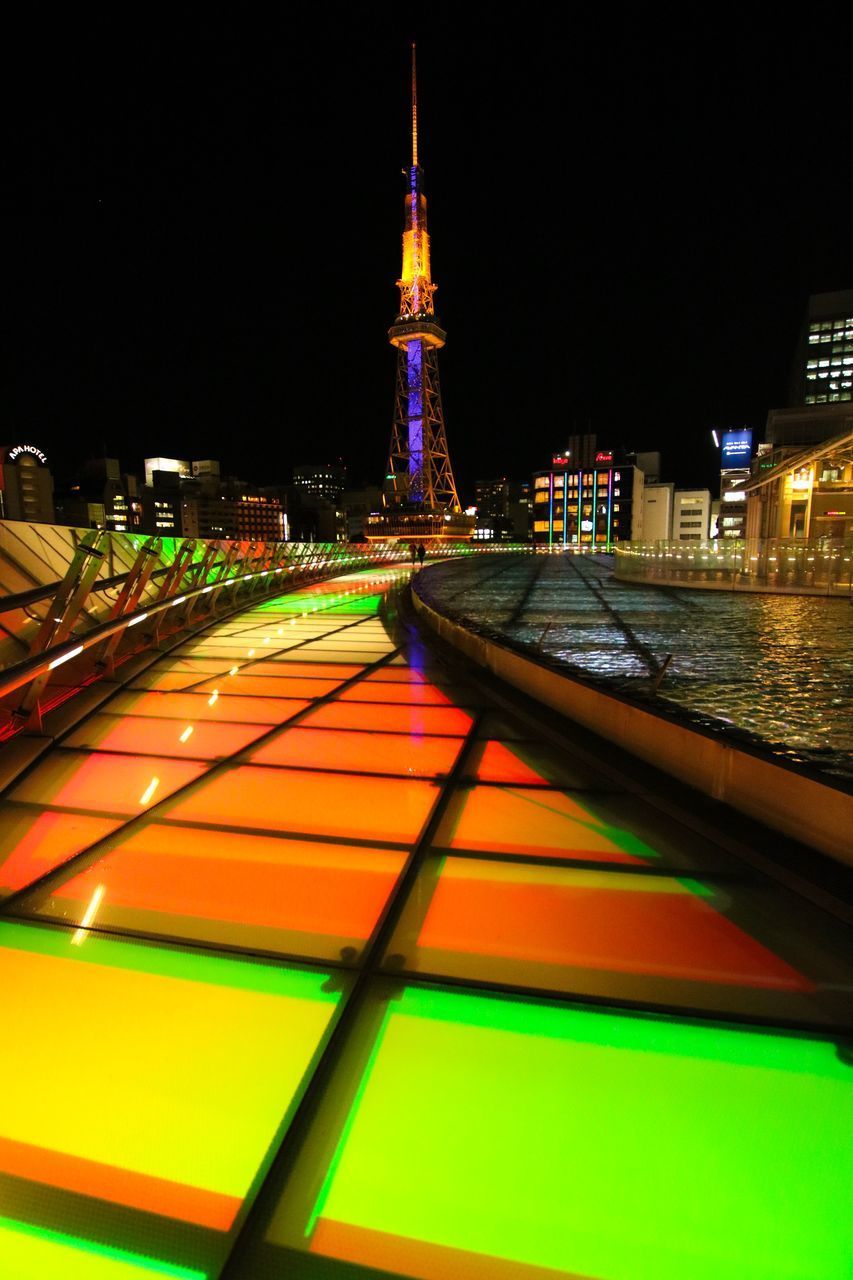 ILLUMINATED BUILDINGS AGAINST SKY