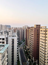 High angle view of buildings in city against sky during sunset