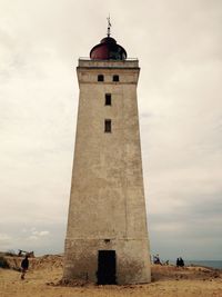 Low angle view of tower against cloudy sky