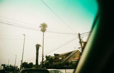 Low angle view of telephone pole against clear sky