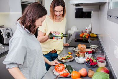 Women preparing food at kitchen