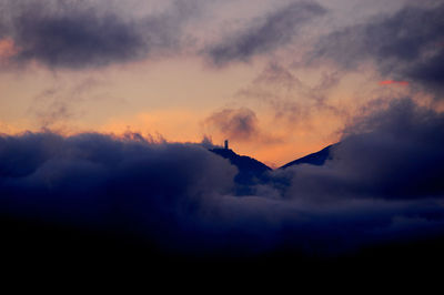 Low angle view of silhouette mountain against sky during sunset