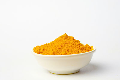 High angle view of bread in bowl against white background