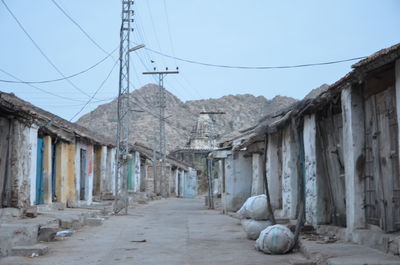 Street amidst buildings against sky