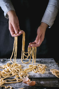 Midsection of man preparing food