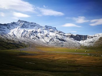 Scenic view of snowcapped mountains against sky