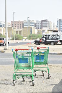 Side view of empty road against buildings in city