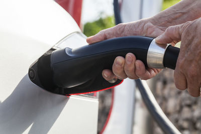 Charging of an electric car, close-up