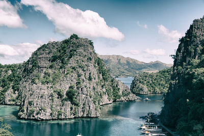 Panoramic view of river amidst trees against sky