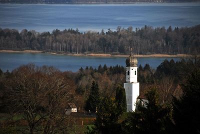 Church on field against river