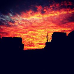 Silhouette of built structure against dramatic sky