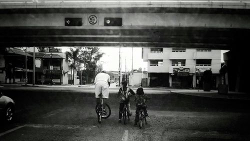 Man riding bicycle on city street