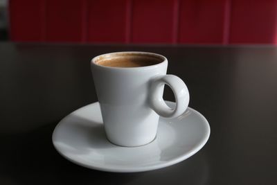 Close-up of espresso coffee on table at cafe