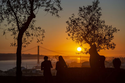 Silhouette people at sunset