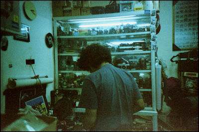 Rear view of man working at restaurant