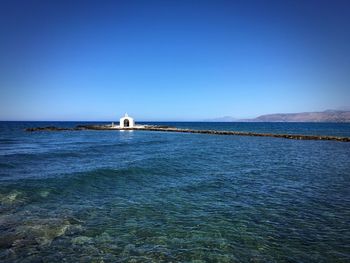 Scenic view of sea against clear sky