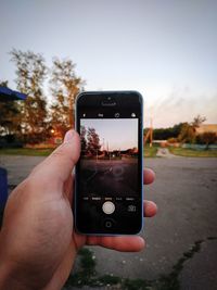 Midsection of person using smart phone