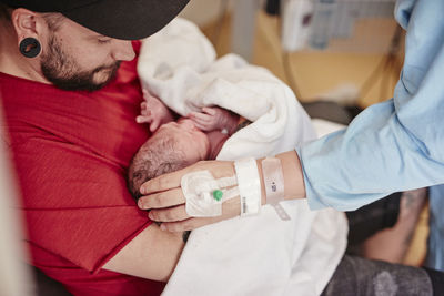 Father holding newborn baby