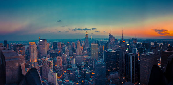 Aerial view of city at sunset