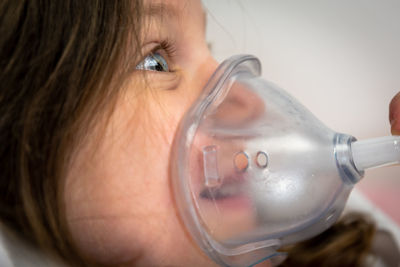 Close-up portrait of woman drinking glass